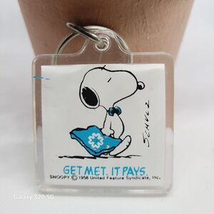 Snoopy Get Met It Pays Keychain 1958 United Feature Syndicate Vintage